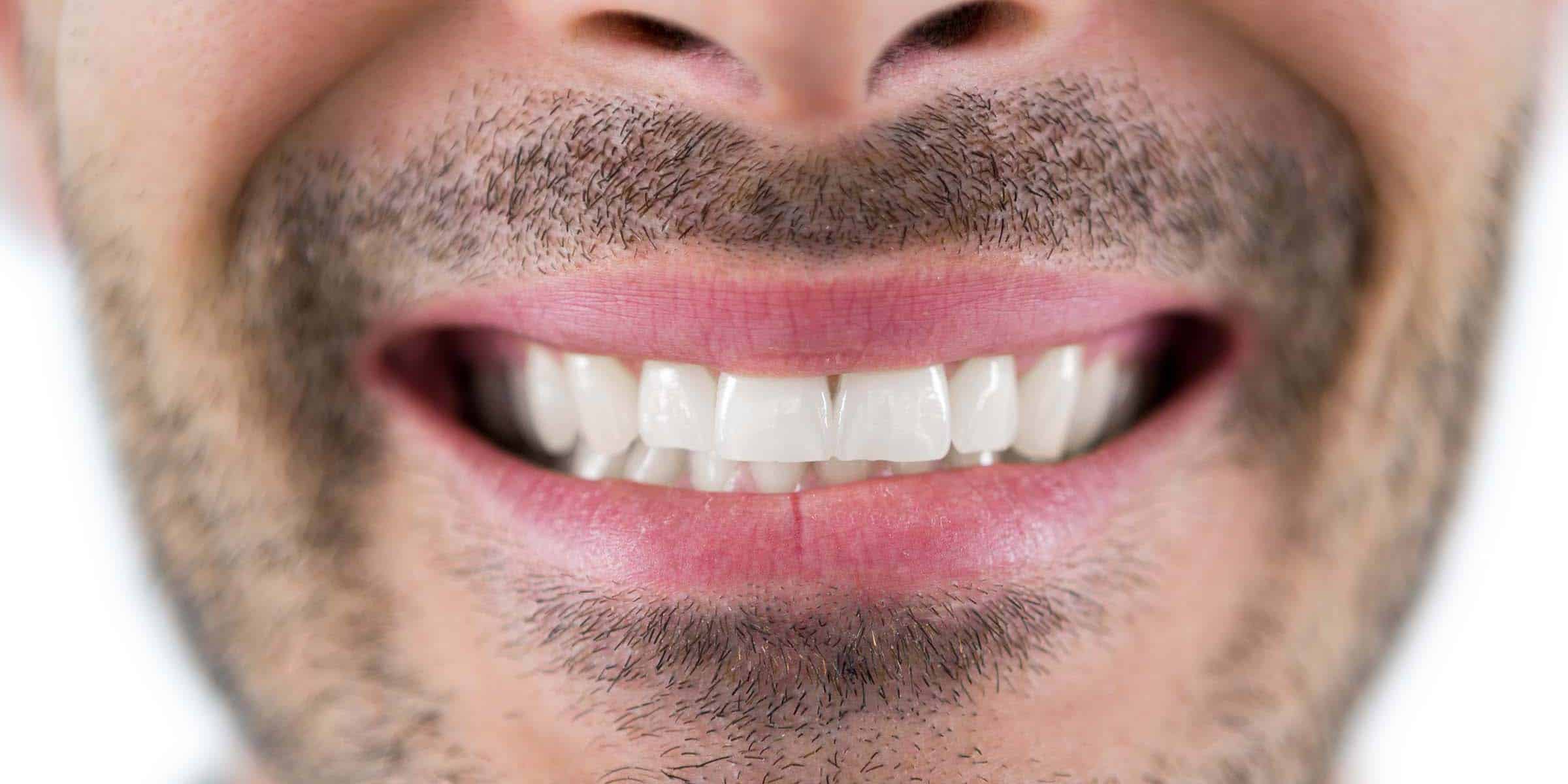 Close-up of man showing his teeth